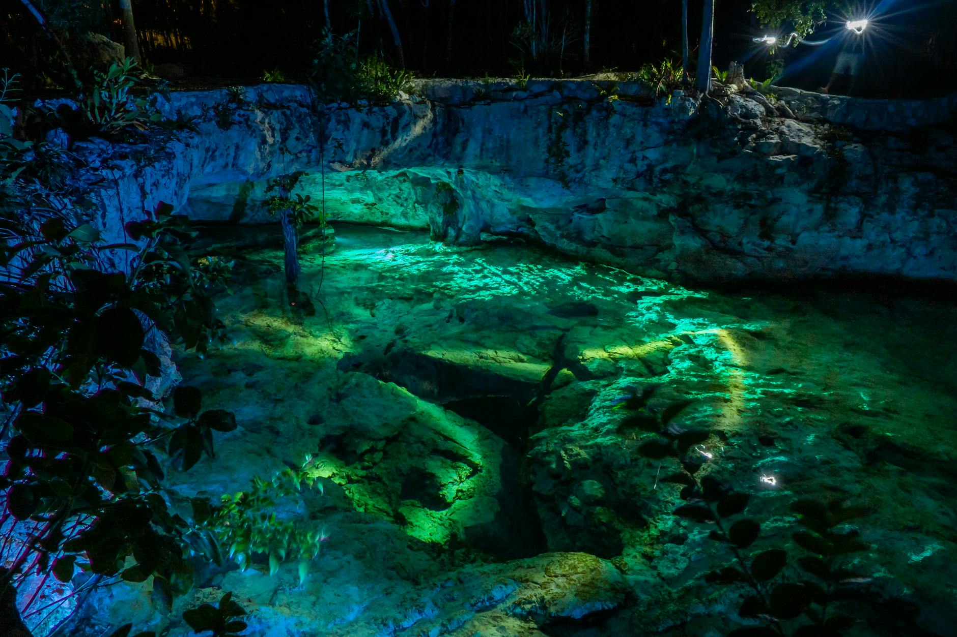 the cave is lit up with green lights